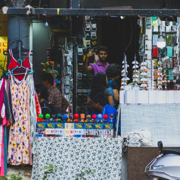 Colorful street market in Mumbai showcasing diverse products and bustling activity.