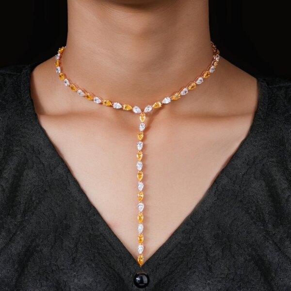 Stunning diamond and gemstone necklace against a black background.